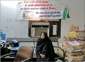  ??  ?? A woman waits for her turn to to enrol for the Unique Identifica­tion (UID) database system, also known as Aadhaar, at a registrati­on centre in New Delhi, on 17 January 2018.