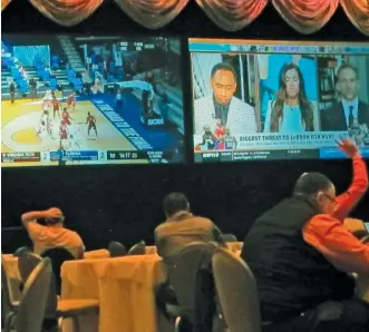  ?? AP ?? Florida officials (top) approved a deal that allows the Seminole Tribe to accept bets off-property. Customers in Atlantic City watch the NCAA Tournament. New Jersey was the first state to reach $5 billion in sports-betting business.