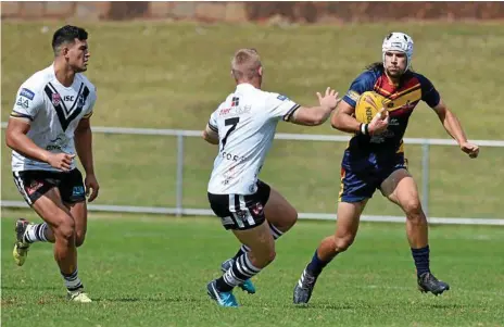  ?? Photo: Kevin Farmer ?? EYES UP: Tom Davis looks to bust through the Souths Logan Magpies defensive line during the Mustangs 46-26 loss in the final round of the Mal Meninga Cup at Gold Park yesterday.