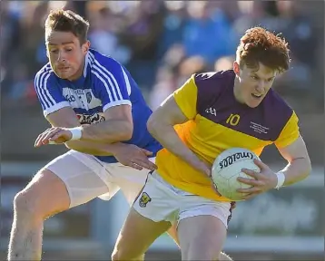  ??  ?? James Stafford shakes off Kieran Lillis, whose extra-time goal left no way back for Wexford.