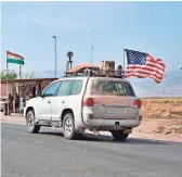  ?? AP ?? A U.S. military convoy arrives near Dahuk, Iraq, Monday. Defense Secretary Mark Esper said Monday that all U.S. troops leaving Syria will go to Iraq.