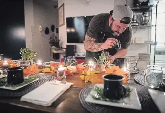  ?? DARRYL DYCK THE CANADIAN PRESS ?? Chef Travis Petersen uses a dropper to add THC distillate to an amuse bouche of toasted farro and young pine broth before guests arrive for a multi-course cannabis-infused meal in Vancouver.