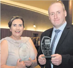  ??  ?? Patricia and Colm Gray, from Draperstow­n, who were named Northern Ireland Foster Carers of the Year and (right) eight-year-old Daniel and Sean (6) with Belfast HSC Trust foster carer Veronica Davidson, the Trust fostering mascot and Nicola McCreedy of VOYPIC (Voice of Young People in Care) to celebrate the launch of Foster Care Fortnight 2018 which runs from May 24-27