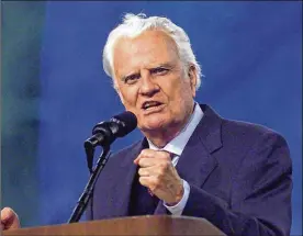  ?? DAYTON DAILY NEWS 2002 ?? The Rev. Billy Graham speaks at Paul Brown Stadium in June 2002. He was a confidant to U.S. presidents from Dwight Eisenhower to George W. Bush.