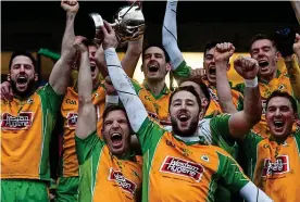  ?? SPORTSFILE ?? Raising the roof: Corofin captain Ciaran McGrath lifts the cup at Tuam Stadium