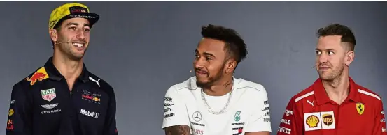  ?? — AFP ?? Speed demons: (From left) Red Bull’s Daniel Ricciardo, Mercedes’ Lewis Hamilton and Ferrari’s Sebastian Vettel answering questions during a press conference at the Albert Park circuit in Melbourne ahead of the Australian Grand Prix yesterday.