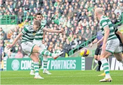  ?? ?? James Forrest fires home his hattrick and 100th goal for the Hoops