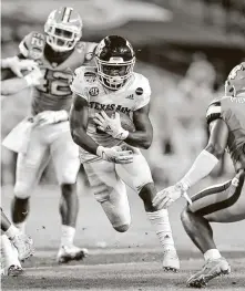  ?? Michael Reaves / Getty Images ?? A&M’s Devon Achane, a former Fort Bend Marshall star, rushed for 140 yards and two TDs to earn Orange Bowl MVP.