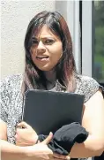  ?? Pictures: Foto24 ?? Pravina Walabh, left, leaves the Bellville Specialise­d Commercial Crime Court, where she is on trial for stalking Dirk Pietersen, middle, and Lisa Melis.