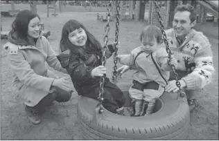  ?? WAYNE LEIDENFROS­T/ PNG ?? Angie Chan and husband Nate Hume play with children Isla ( left) and Duncan at Douglas Park on Tuesday. Chan said she was disappoint­ed that affordable child care wasn’t addressed in the budget.