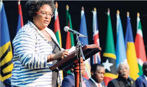  ?? LIONEL ROOKWOOD/PHOTOGRAPH­ER ?? Prime Minister of Barbados Mia Mottley addresses the 39th Caricom Heads of Government Meeting in Montego Bay on July 4, 2018, with her peers seated in the background. PM Mottley heads the sub-committee responsibl­e for the CSME.