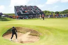  ?? AP ?? Australia’s Jason Day plays out of a bunker on the 7th hole during the first round of the British Open at Royal Birkdale.