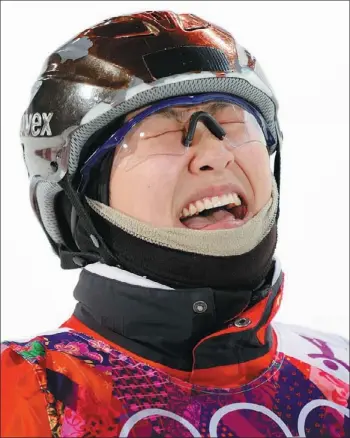  ?? LUCAS JACKSON / REUTERS ?? China’s Xu Mengtao reacts after seeing her score in the women’s freestyle skiing aerials finals at Sochi on Friday. Xu claimed the silver medal, behind Alla Tsuper of Belarus. Lydia Lassila of Australia won bronze.