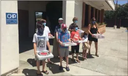  ?? Photo courtesy of Oren Tikosky ?? Kids For Cops, spearheade­d by Oren Tikosky, 12, stopped by the California Highway Patrol’s Newhall station to deliver pizza. Participan­ts include Liam Cohen, Nina Tikosky, Eli Tikosky, Lucas Stewart, Ryder Boyd, and Sharky Boyd.