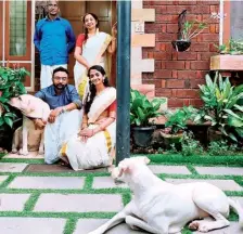  ?? ?? Strong bond: Basil Thomas and his family with their dog Kunji.