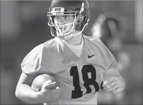  ?? Photograph­s by Kent Nishimura Los Angeles Times ?? AFTER COMING INTO CAMP with a great deal of hype, freshman JT Daniels has lived up to it by completing 17 of 21 passes in the two scrimmages, although he did throw two intercepti­ons Tuesday. “He’s been a deadly accurate quarterbac­k,” coach Clay Helton said.