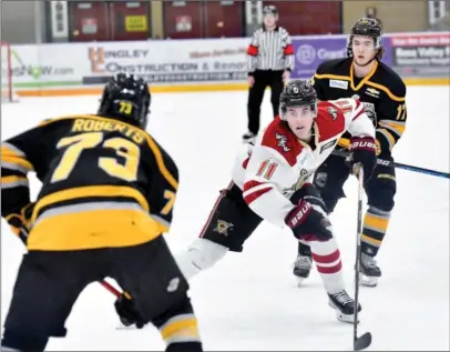  ?? TAMI QUAN/Special to Okanagan Newspaper Group ?? West Kelowna Warrior Jayden Moriello races for a loose puck Saturday in a 5-2 loss to Coquitlam.