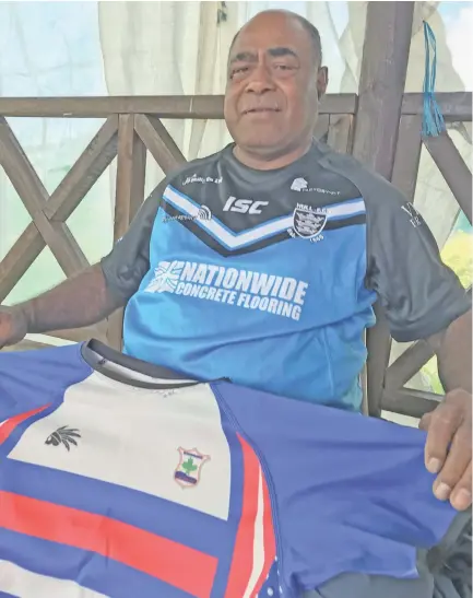  ?? Photo: Waisea Nasokia ?? Proud father Jona Saturu Naulago at Sabeto Village, Nadi on May 21, 2020. He holds the jersey that was sponsored by his son for the Ravoravo rugby team.