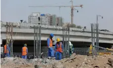  ?? Getty Images ?? The downturn in Oman means foreign constructi­on workers have gone months without their wages