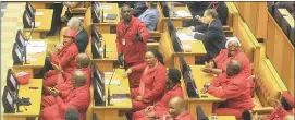  ??  ?? RED FLAG: The EFF were in full cry yesterday when they chanted “pay back the money”, disrupting proceeding­s before President Jacob Zuma could answer even one question.