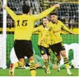  ?? Foto: Federico Gambarini, dpa ?? Die Dortmunder jubeln über das Tor von Jadon Sancho (rechts) in der 3. Minute.