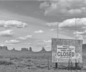  ?? ASSOCIATED PRESS FILE PHOTO ?? A sign in April warns that Monument Valley is closed on the Navajo Nation in Utah. Tribes across the country have gone to great efforts to protect their elders from COVID-19.