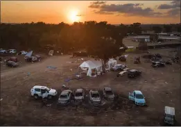  ?? SERGEY PONOMAREV — THE NEW YORK TIMES ?? Abandoned and destroyed vehicles remain scattered Oct. 11at the site of the Nova music festival, where witnesses reported seeing rapes nearby after the Hamas-led attacks on Oct. 7, near the Israeli kibbutz of Re'im.