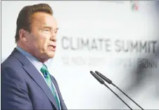  ?? AP PHOTO ?? Former governor of California Arnold Schwarzene­gger talks in the “BonnZone” during the World Climate Conference in Bonn, Germany. During the summit, cities and regions emphasize that climate protection is not only an issue for national government­s.