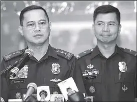  ?? BOY SANTOS ?? Lt. Gen. Archie Francisco Gamboa (left) faces the media at Camp Crame yesterday as OIC of the Philippine National Police. Beside him is PNP spokespers­on Brig. Gen. Bernard Banac.