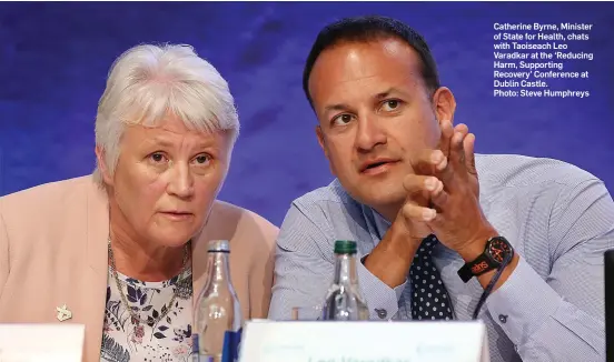  ?? Photo: Steve Humphreys ?? Catherine Byrne, Minister of State for Health, chats with Taoiseach Leo Varadkar at the ‘Reducing Harm, Supporting Recovery’ Conference at Dublin Castle.