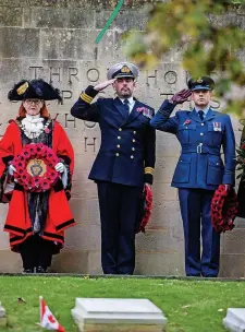  ?? ?? > Above and left: The Lord Mayor of Bristol, Councillor Paula O’Rourke, and other dignitarie­s lay wreaths at Arnos Vale Cemetery in the city; below: veterans on their way to a Remembranc­e Day service at Weymouth cenotaph