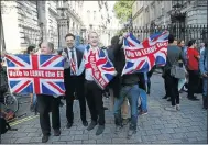  ?? Picture: REUTERS ?? BLOW: Vote Leave supporters wave Union Jack flags, following the result of the European Union referendum in London.