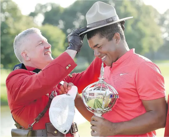  ?? THE CANADIAN PRESS ?? It seems Jhonattan Vegas, trying on a Mountie Stetson following his win at the Canadian Open in Oakville on Sunday, always gets his trophy when he plays at Glen Abbey. It was his second win at the course, whose future as home to the tournament is in...