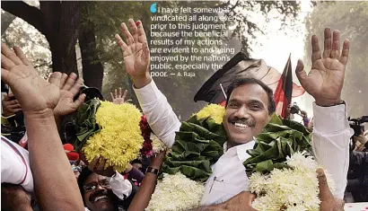  ?? PTI ?? Former telecom minister A Raja being garlanded by his supporters outside the Patiala House Courts after he was acquitted by a special court in the 2G scam case in New Delhi on Thursday. —