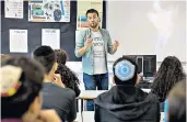  ??  ?? Jonny Benjamin, right, and talking to students at his old school, left