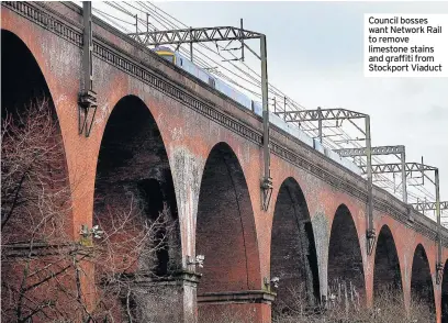  ??  ?? Council bosses want Network Rail to remove limestone stains and graffiti from Stockport Viaduct