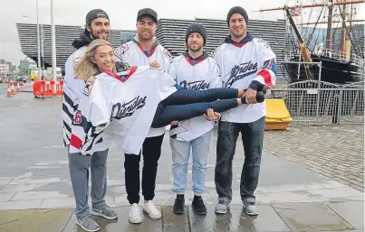  ?? Picture: Kim Cessford. ?? Designer Lucy Hendry with one of the new shirts and team members, from left, Patrick Lee, Malcolm Gould, Gabriel Levesque and Marc Oliver.