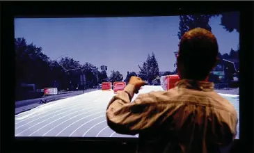  ?? PHOTOS BY DAN HONDA / BAY AREA NEWS GROUP ?? Danny Shapiro, senior director of automotive work at Nvidia, watches a video screen showing the data collected by self-driving cars using the company’s technology in Santa Clara, Calif.