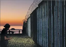  ?? Gary Coronado Los Angeles Times ?? A FORTIFIED wall separates Tijuana from San Diego. President Trump’s emergency declaratio­n seeks to reallocate federal funds for new wall constructi­on.