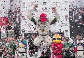  ?? CHRIS YOUNG/The Canadian Press ?? England’s Mike Conway leaps out of his car in celebratio­n after powering his way
to victory in the second race of the Honda Indy Toronto event, Sunday.