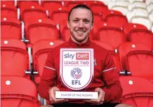  ??  ?? > Exeter City’s Matt Jay with his League Two March player of the month award