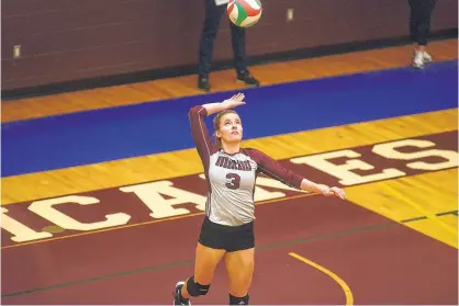  ?? FILE ?? Holland College Hurricanes’ setter Marissa Macaulay prepares to serve during Atlantic Collegiate Athletic Associatio­n women’s volleyball action during the 2019-20 season.