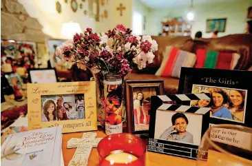  ?? [PHOTO BY BRYAN TERRY, THE OKLAHOMAN] ?? Pictures of Sandra Stevens are seen on a table at the house of her mother Sylvia Stevens in Oklahoma City.