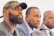  ?? AP FILE ?? Malcolm Jenkins, left, held up handwritte­n signs on issues important to him Wednesday instead of answering questions about the Eagles’ nixed visit to the White House.