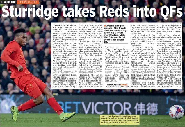  ?? — AFP ?? Liverpool striker Daniel Sturridge scores against Tottenham Hotspur in their English League Cup fourth round match at Anfield on Tuesday. The hosts won 2-1.