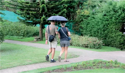  ??  ?? Last week's picture of a tourist couple at the Nuwara Eliya park. Fewer tourists were seen in this holiday town owing to the political crisis.