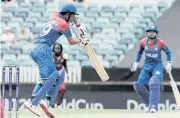  ?? AFP ?? Thailand’s Natthakan Chantham plays a shot against the West Indies.