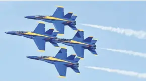  ?? U.S. NAVY BLUE ANGELS ?? The U.S. Navy Blue Angels fly in Diamond Formation maneuvers in front of the crowd at the NAF El Centro Air Show in California in March.