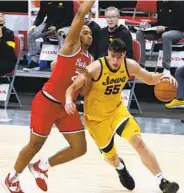  ?? JAY LAPRETE AP ?? Iowa’s Luka Garza drives to the basket against Ohio State’s Zed Key during the second half of Hawkeyes’ win.