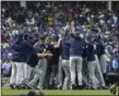  ?? MATT MARTON - THE ASSOCIATED PRESS ?? Milwaukee Brewers players celebrate after defeating the Chicago Cubs 3-1 at the end of a tiebreak baseball game on Monday, Oct. 1, 2018, in Chicago.